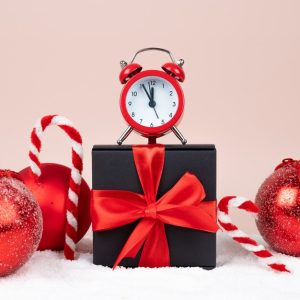 christmas-composition-with-alarm-clock-baubles-candy-canes-gift-box-high-quality-photo_542154-2